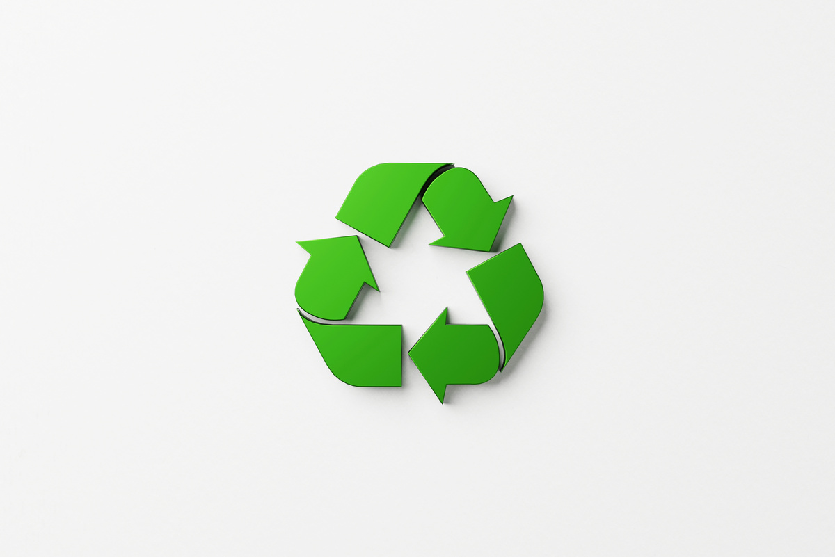 Reuse, Reduce, Recycle Concept. Top View of Recycle Symbol on Wh